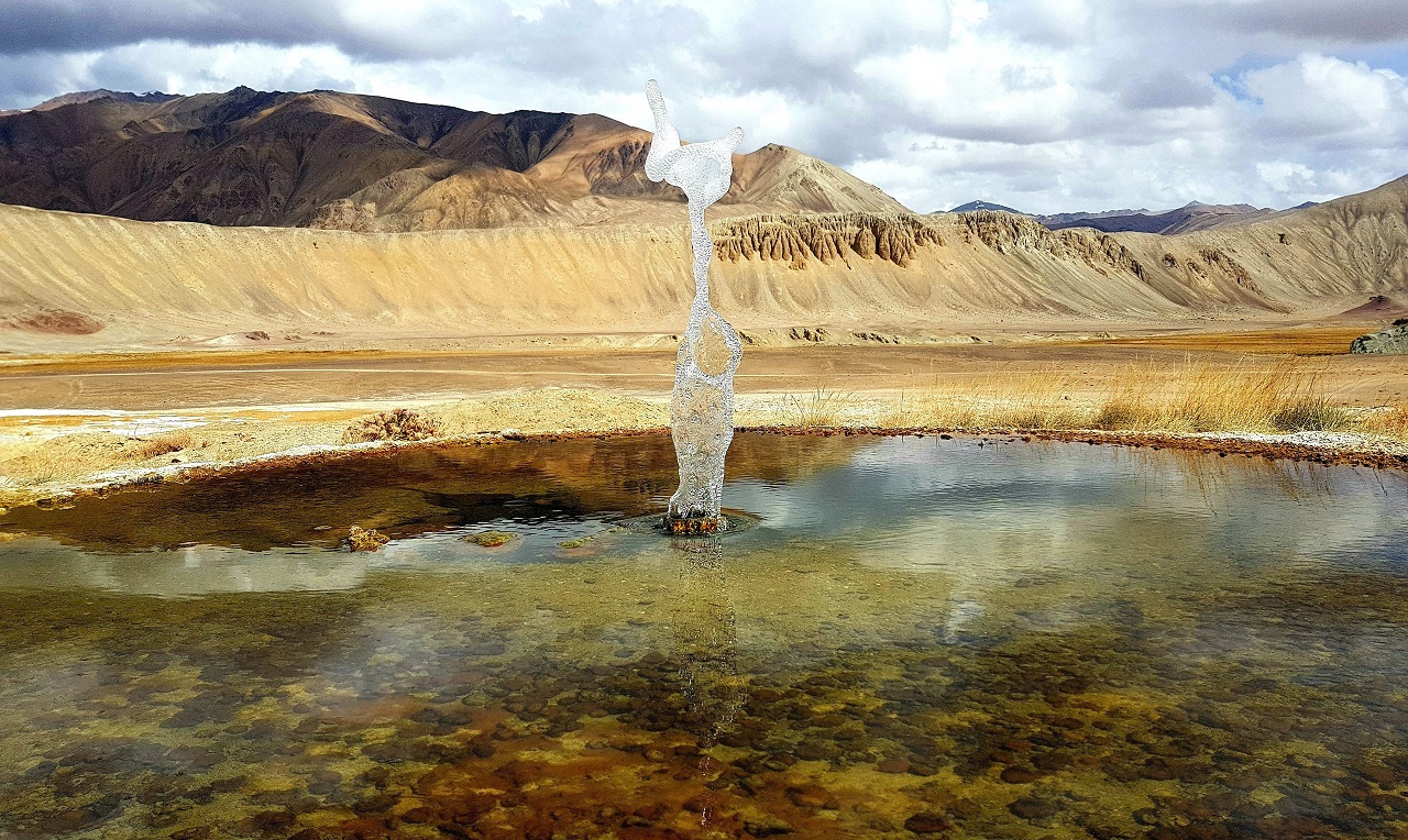 Geyser spouting near Lake Bulunkul, Tajikistan