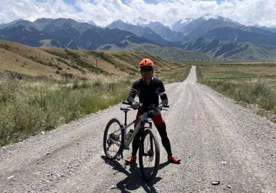 Andrew Mak Cycling on the  tour with redspokes