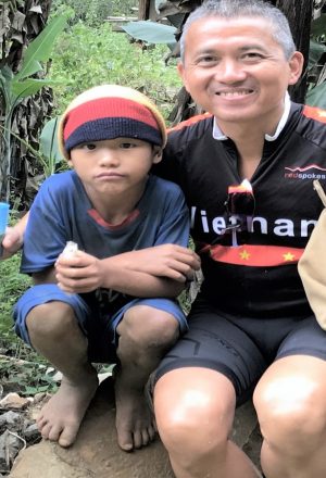 redspokes cyclist meeting local people in Vietnam